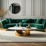 Elegancka sofa glamour szmaragdowa welurowa ze złotymi wykończeniami